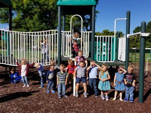 pre-k students pose for a picture