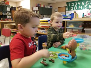 pre-k students play together