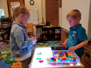 pre-k students play together