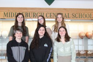 Six students stand in front of Middleburgh Central School sign.