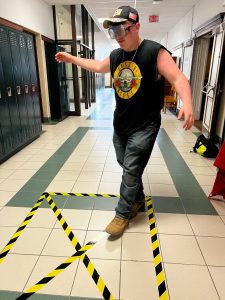 Student attempts to walk a straight line while wearing "drunk" goggles.
