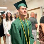 Students in caps and gowns.