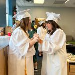 Students in cap and gowns.