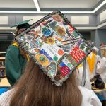 Student graduation cap decorated with photos and SUNY Cobleskill images.