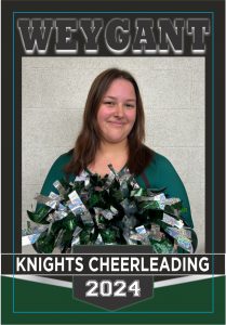 Senior cheerleader poses for banner. She is wearing uniform and holding pom poms.