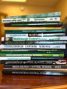 Stack of Middleburgh yearbooks showing their spines and years.