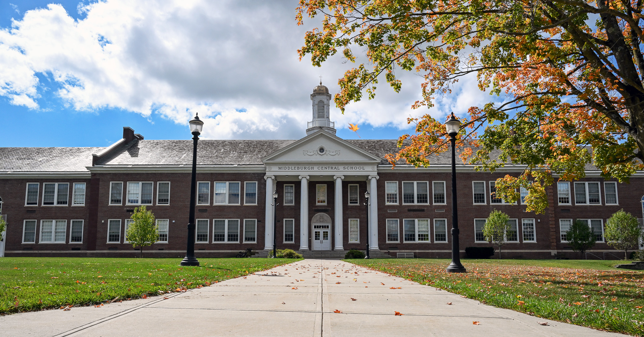 Exterior view of Middleburgh Central School on a sunny fall day.