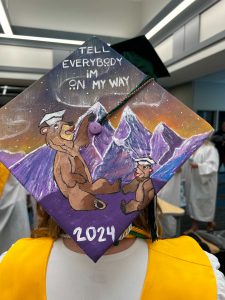 Graducation cap decorated with bears and mountains with the words "Tell everyone I'm on my way." 2024