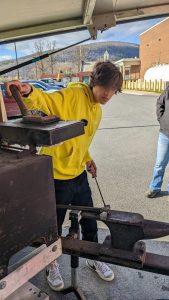 Student practices blacksmithing.