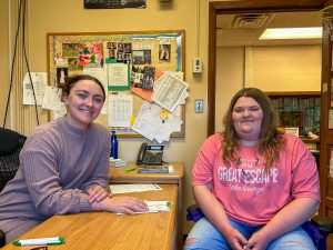 Adult meets with student in counseling center.