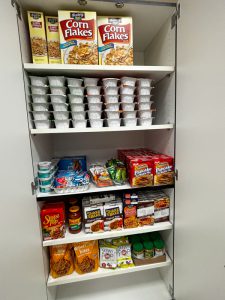 Shelves of non-perishable pantry goods.