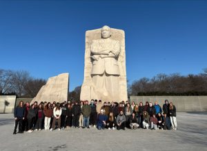 Students and teachers stand in front of of Martin Luther King, Jr. Memorial