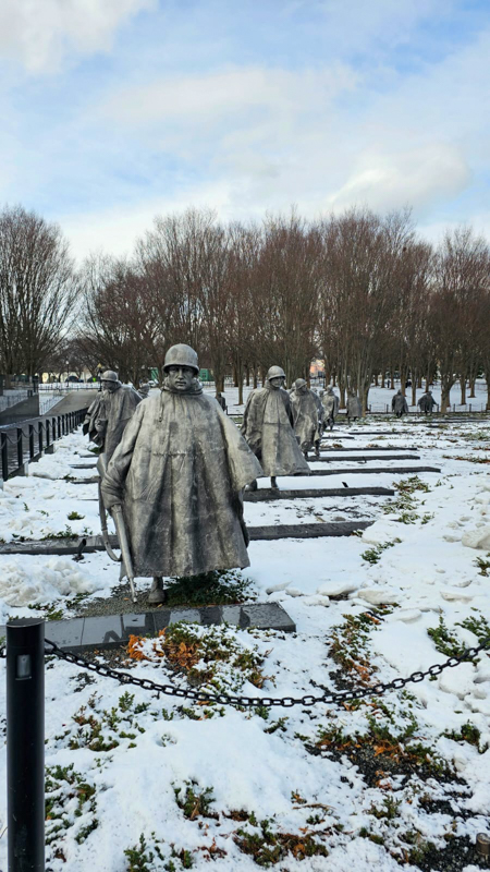 Statues of soldiers in the snow.