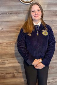 Logan Rivenburg wearing a Middleburgh FFA jacket.